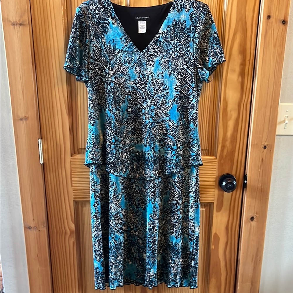 Woman’s pleated dress size 12